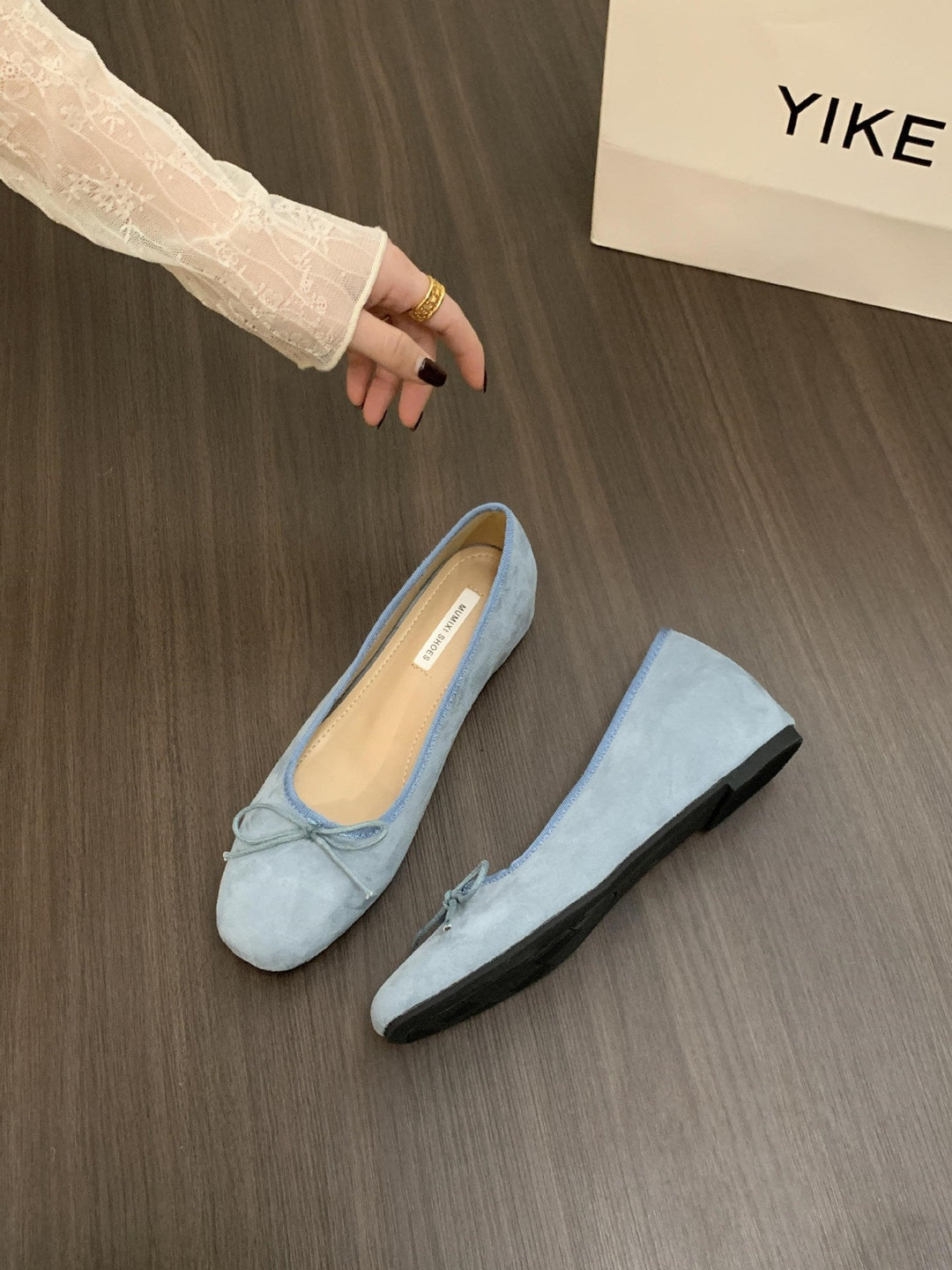 Fashionable women's flat shoes, pretty ballerinas featuring a delicate bow accent.