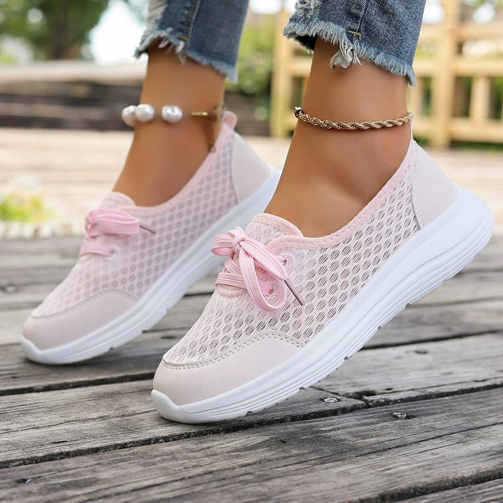 Breathable mesh slip-on sneakers for women, ideal for walking & daily comfort.