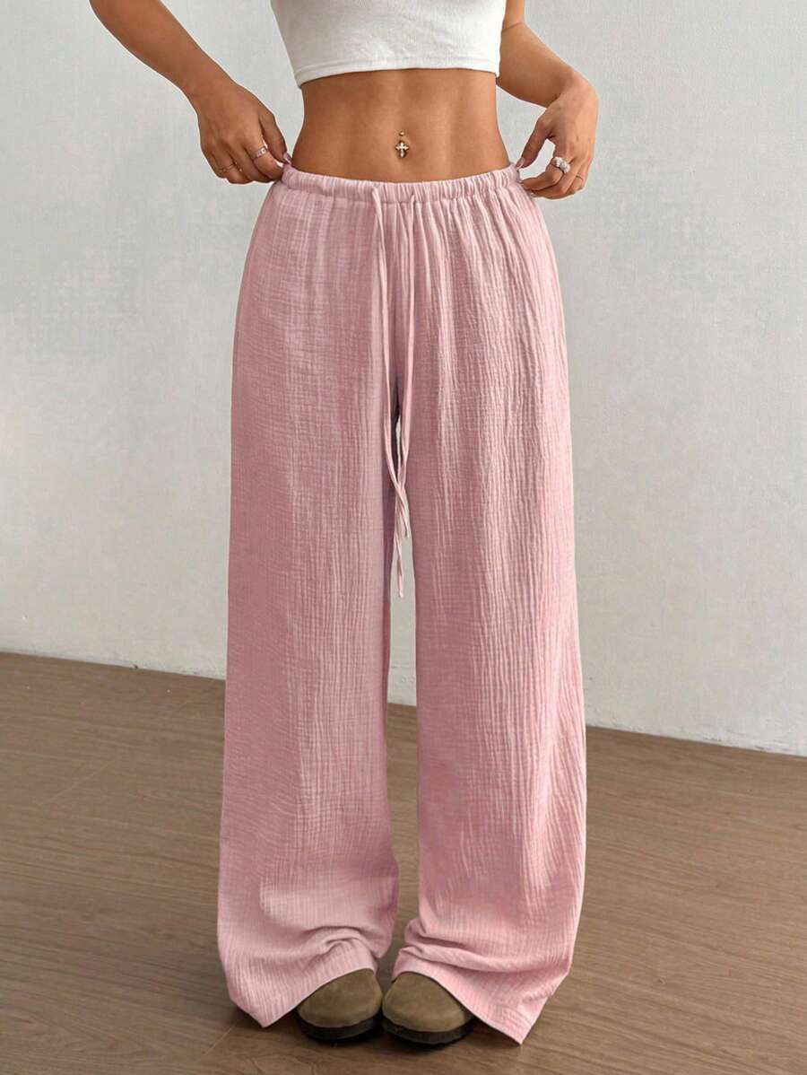 Women's casual wide leg flowy trousers, perfect for comfortable everyday wear. Relaxed fit summer fashion.