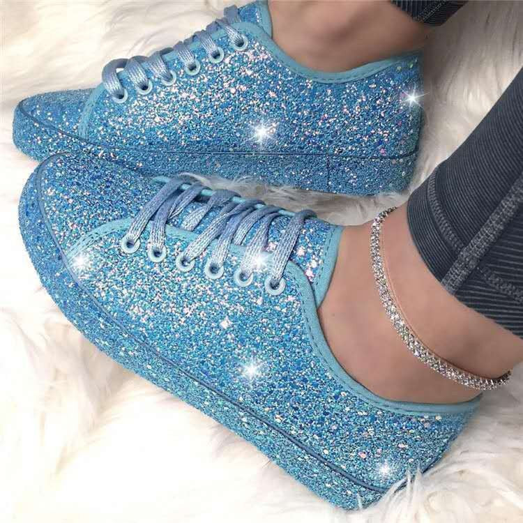 Detailed view of the dazzling glitter texture on women's sparkling fashion sneakers, perfect for party or casual wear.