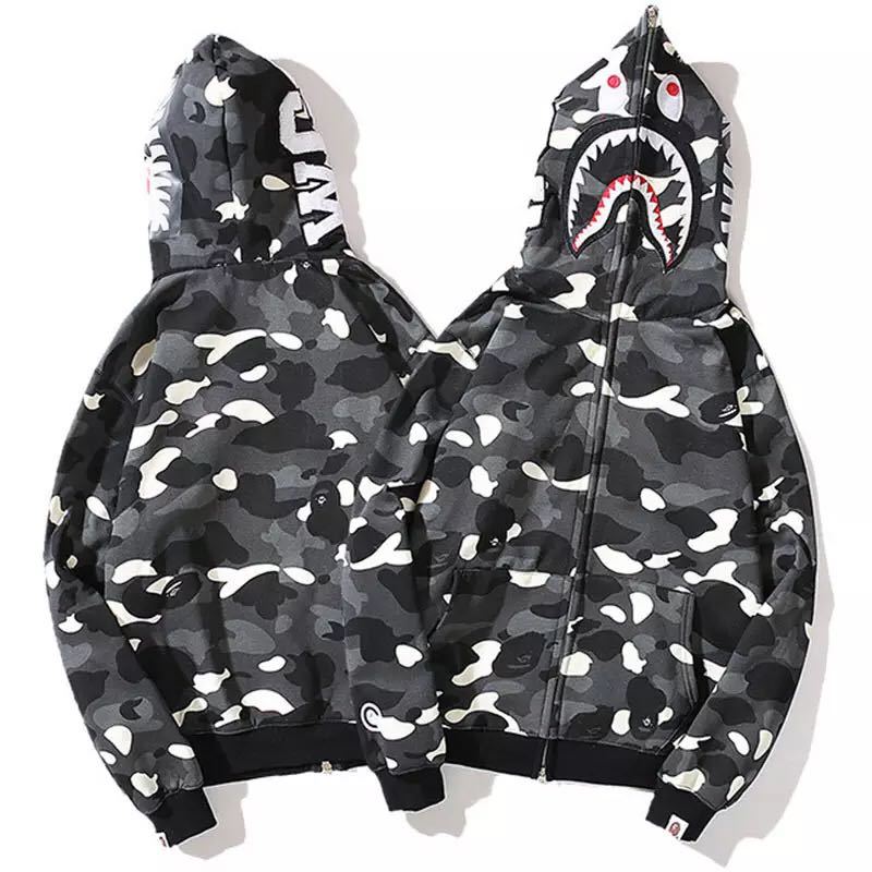 Woman wearing a comfortable camouflage pullover hoodie. Ideal for casual wear & stylish street fashion.
