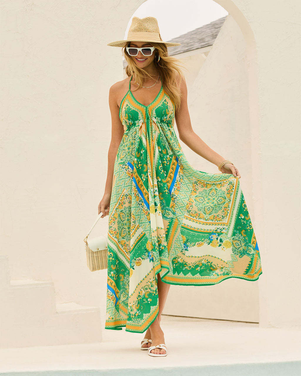 Stunning women's floral halterneck maxi dress with a vibrant pattern. Perfect flowy summer dress for elegant occasions.