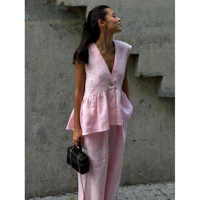 Elegant yet casual women's V-neck top & wide-leg pants set, perfect for relaxed summer days.