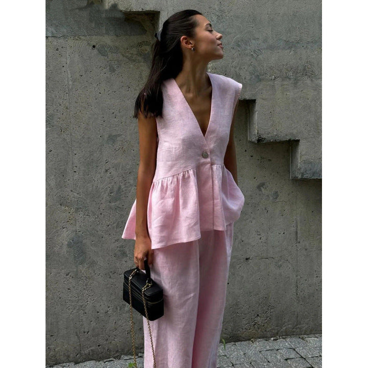 Elegant yet casual women's V-neck top & wide-leg pants set, perfect for relaxed summer days.