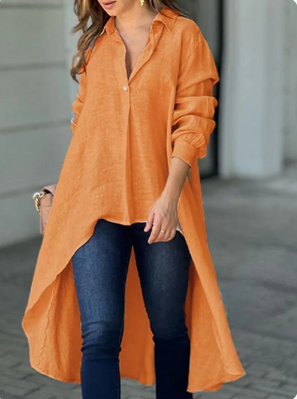 Flat lay of a women's white casual long blouse, relaxed fit summer fashion top.