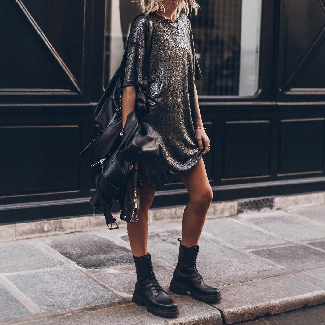 Comfortable women's oversized black glitter dress, shimmering with a chic side slit for a fashionable look.