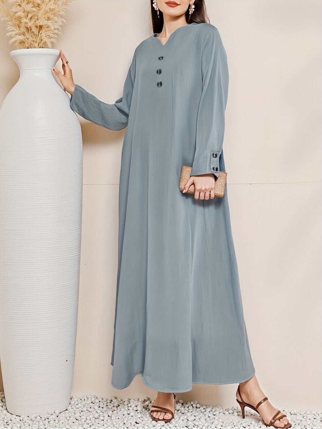 Flowy women's button-front maxi dress. Elegant long summer dress for effortless style, perfect for casual or evening fashion.