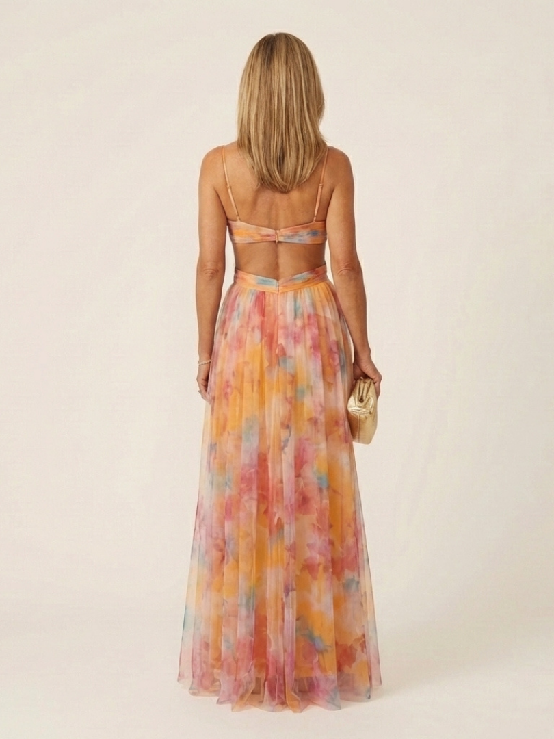 Flowing V neck maxi dress for women, featuring a sleeveless design and delicate pleats, versatile for events.