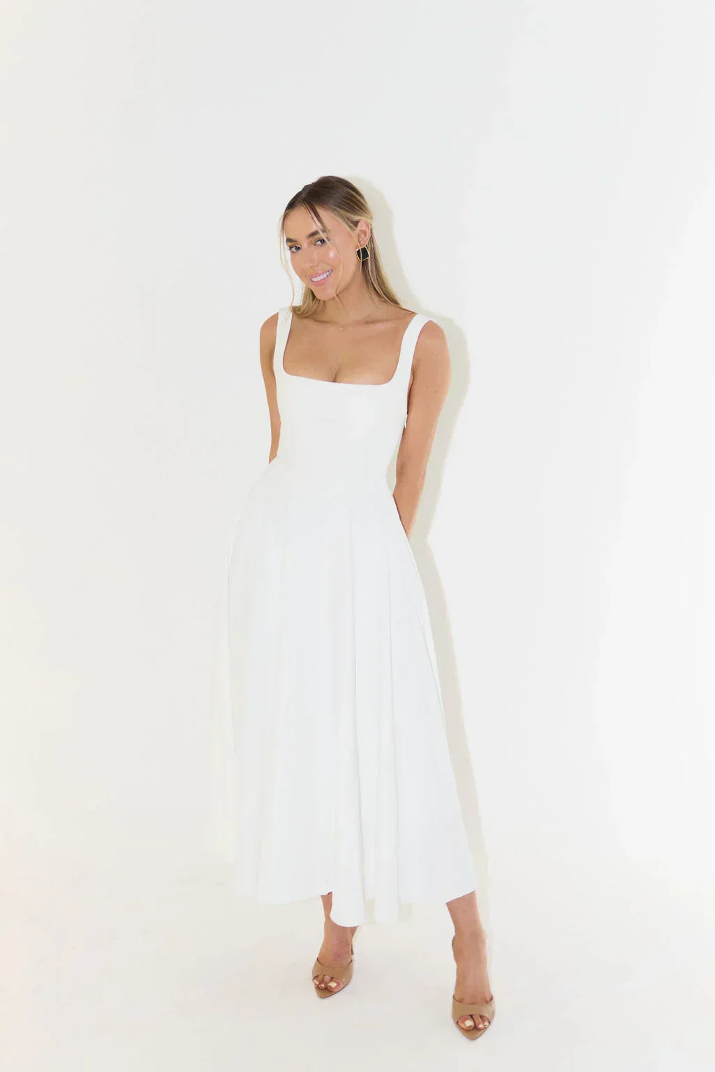 Fashionable women's square neck midi dress with a high waist design, perfect for elegant comfort.
