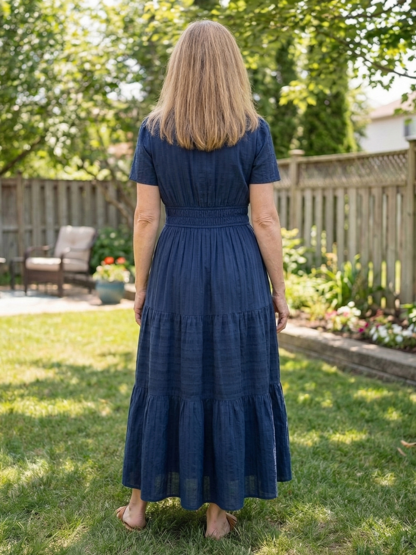 Flowing short sleeve tiered maxi dress for women, ideal for versatile spring and summer casual style.