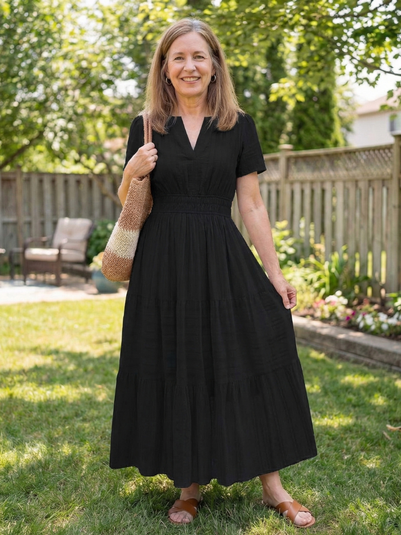 Elegant women's short sleeve tiered maxi dress featuring a flattering smocked waist. Perfect casual summer outfit.