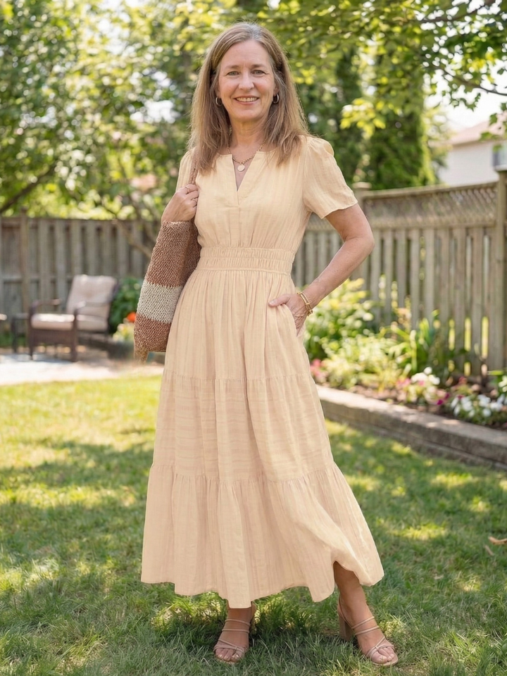 Stylish women's short sleeve tiered maxi dress, a flowing and comfortable choice for summer casual fashion.