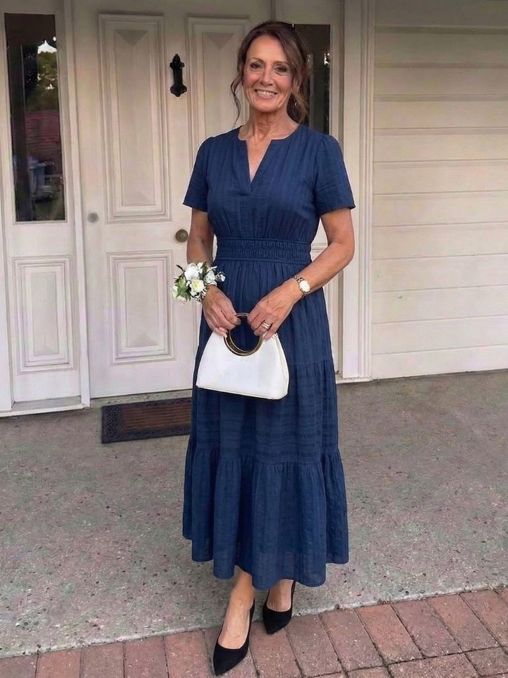 Comfortable women's tiered maxi dress, short sleeves & smocked waist for effortless spring/summer fashion.