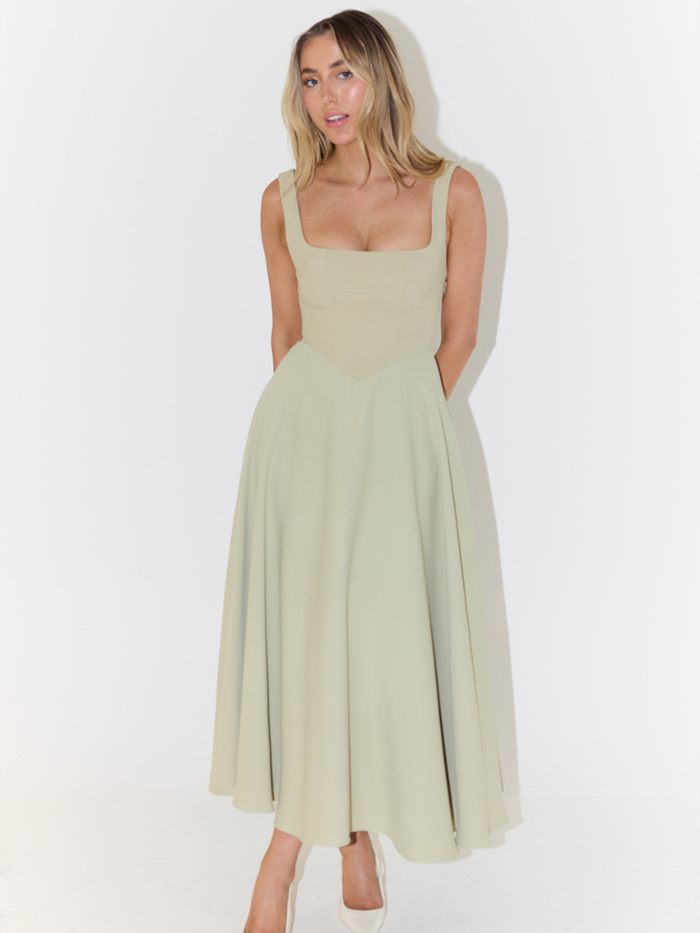 Waist detail of elegant women's midi dress, fashionable, comfortable & chic for occasions.