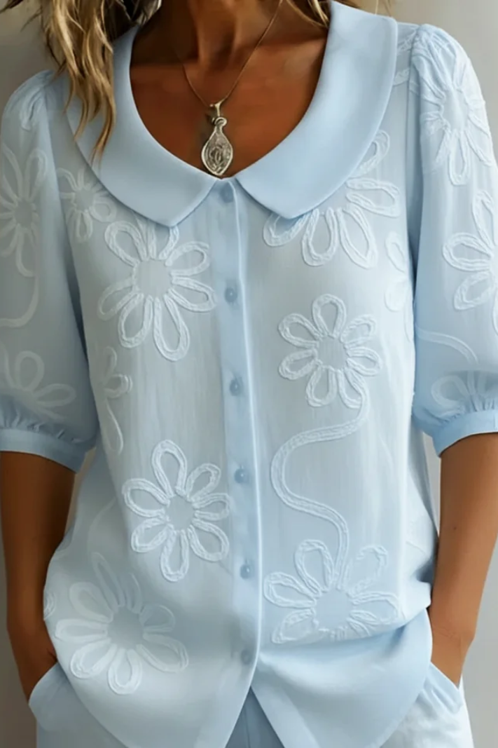 Women's elegant floral shirt, a versatile top with a relaxed fit for feminine style and everyday wear.