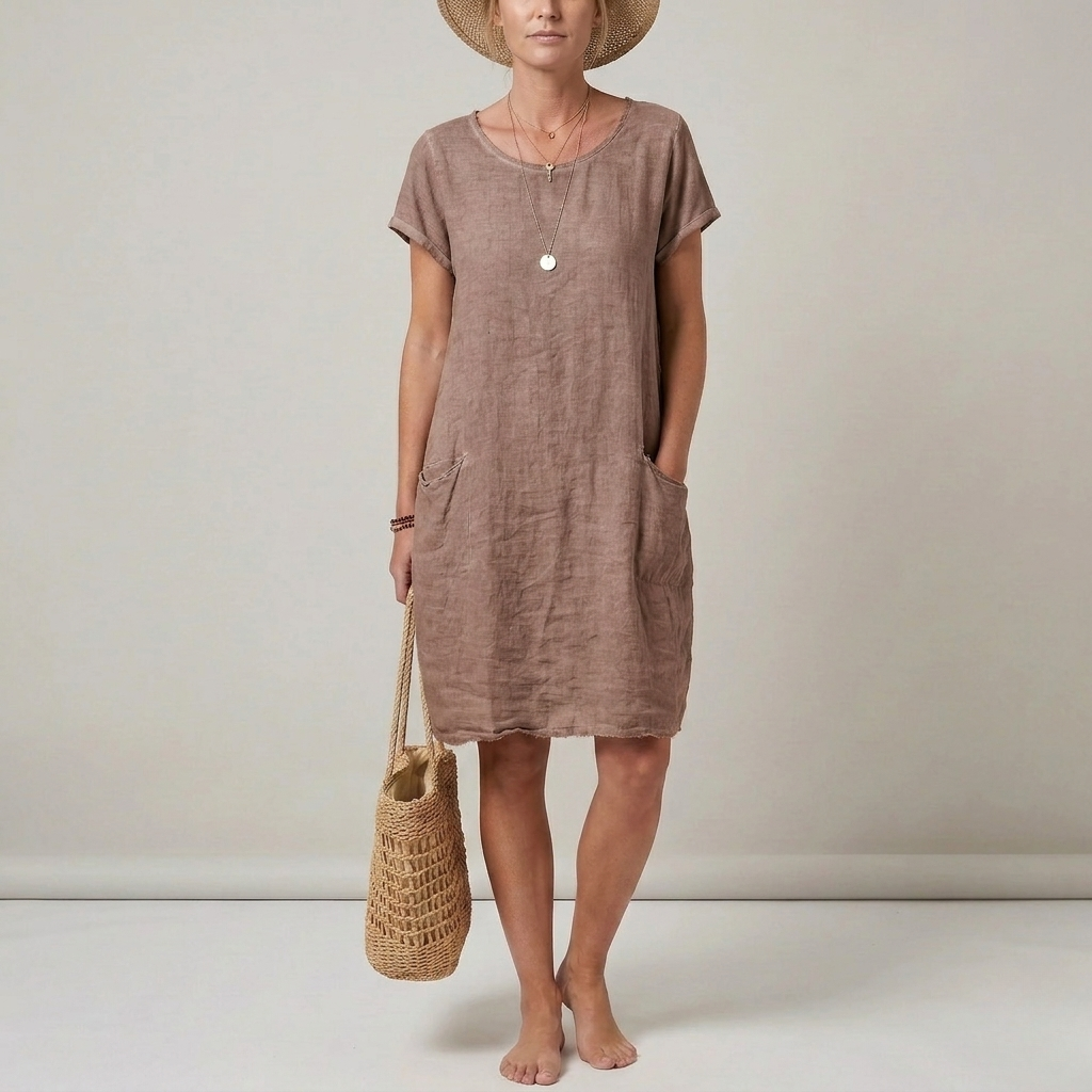 Relaxed fit women's mini shift dress for spring & fall. Casual, comfortable with short sleeves, round neck & patch pockets.
