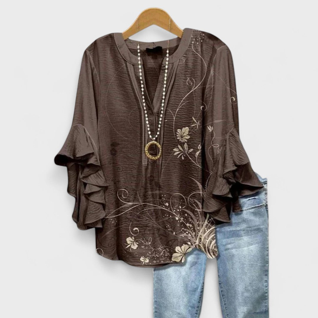 Women's V-neck blouse with elegant ruffled sleeves, a sophisticated top for any occasion.
