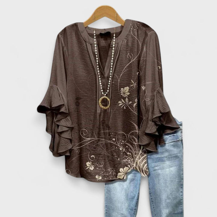 Women's V-neck blouse with elegant ruffled sleeves, a sophisticated top for any occasion.