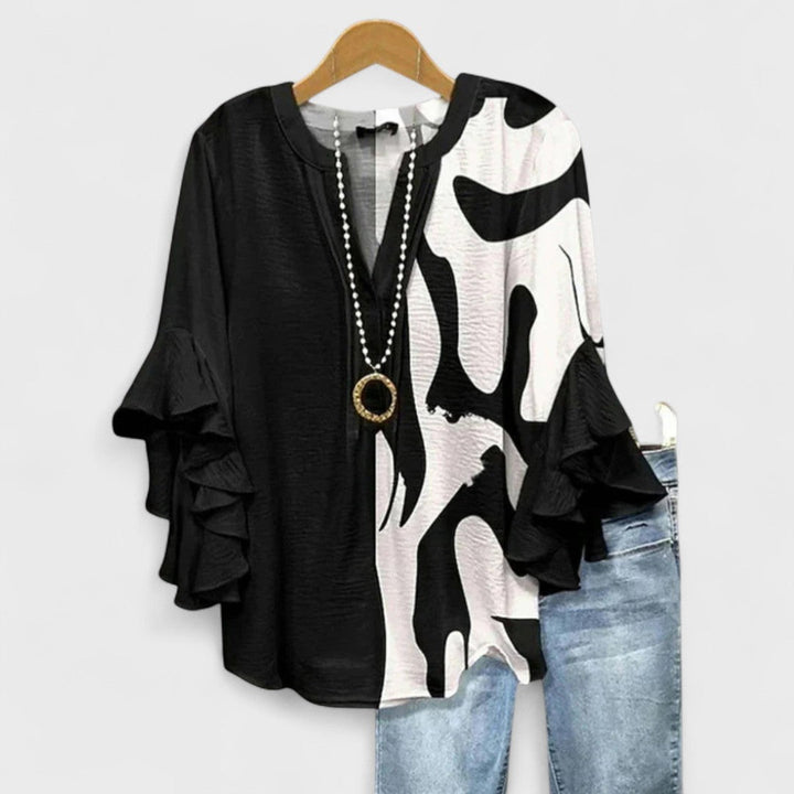 Casual women's V-neck top featuring pretty ruffle sleeves, great for everyday summer wear.