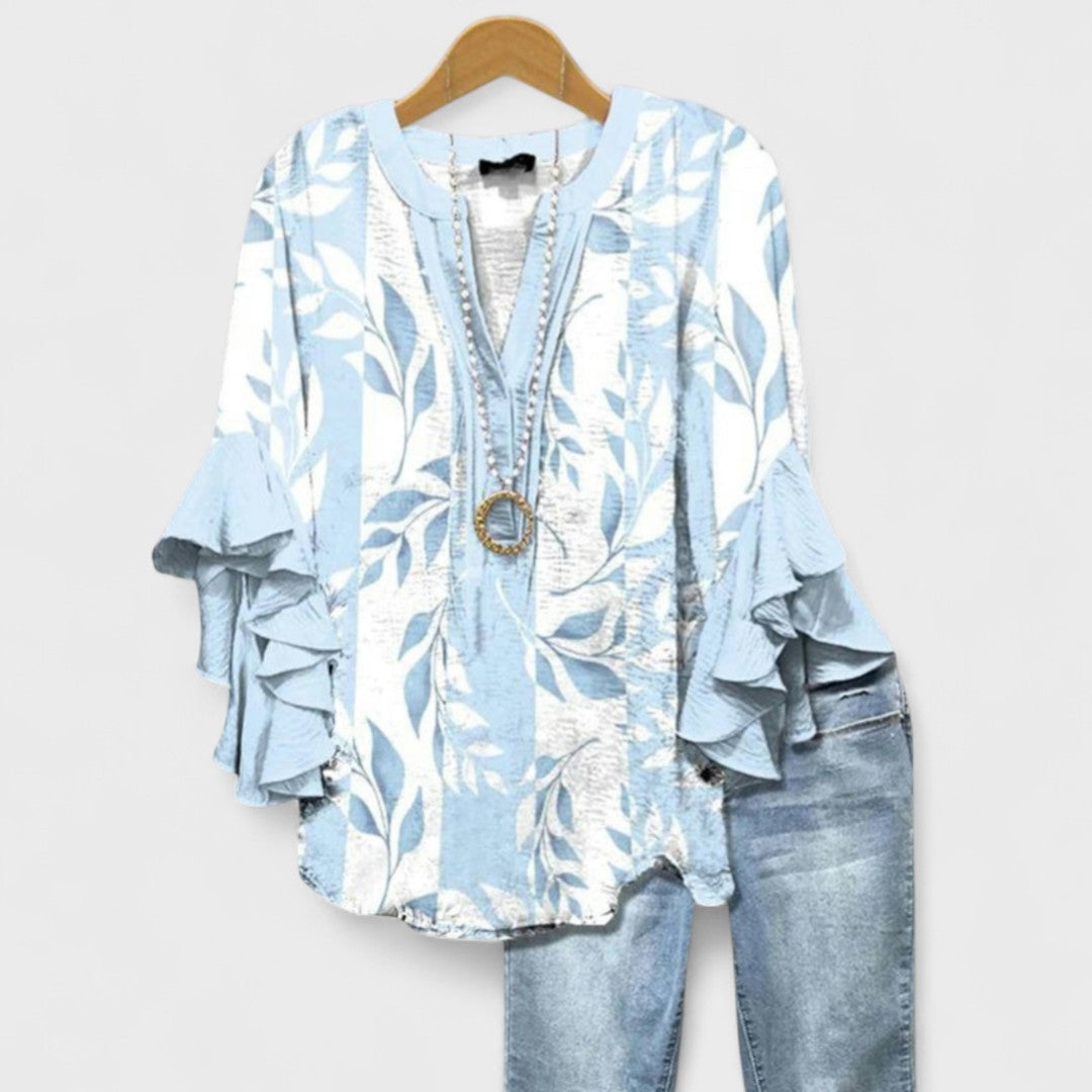 Chic women's V-neck top with stylish ruffle sleeves, ideal for a sophisticated summer outfit.