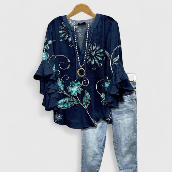 Stunning women's floral blouse with elegant ruffle sleeves, a perfect blend of style and feminine charm.