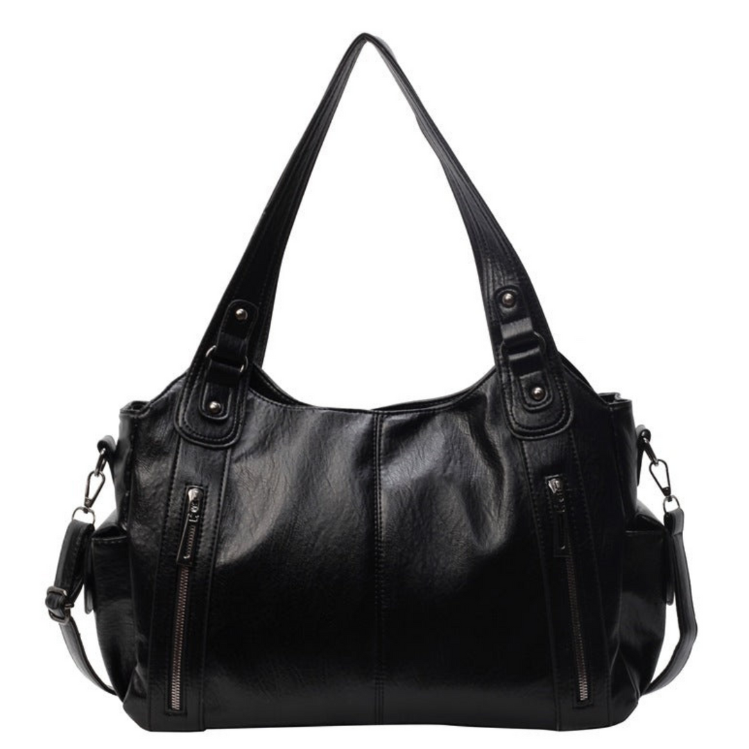 Close-up of the smooth vegan leather women's tote bag with elegant silver hardware details.