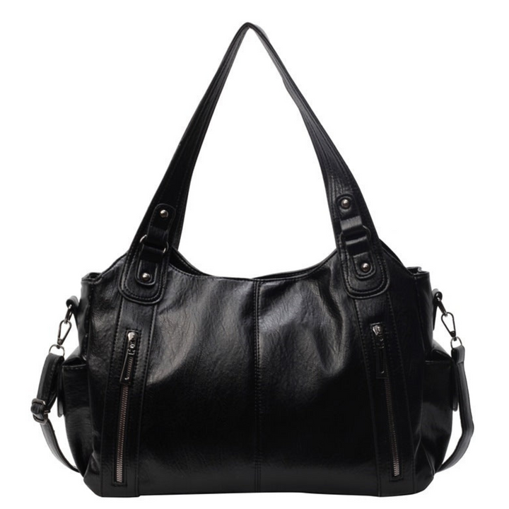 Close-up of the smooth vegan leather women's tote bag with elegant silver hardware details.