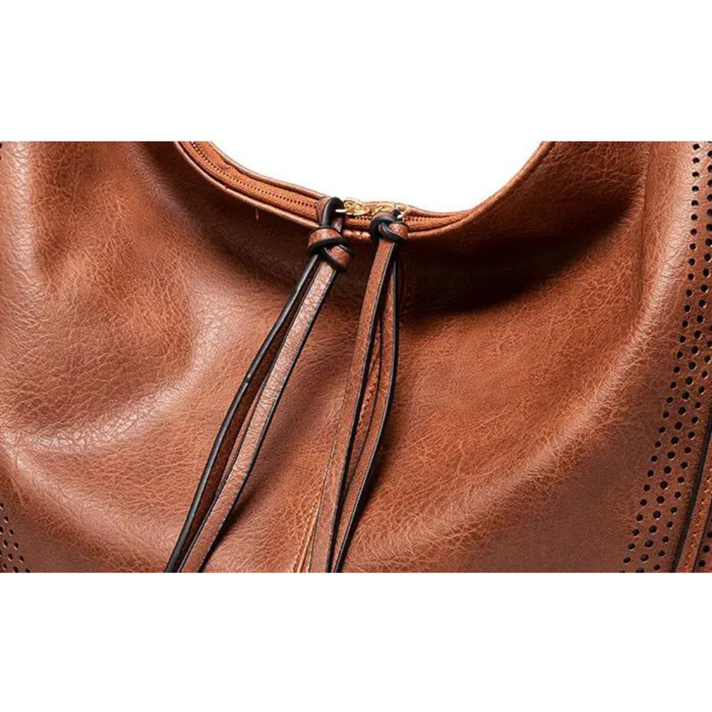 A versatile women's vintage brown leather bag worn on the shoulder, combining style & practicality.