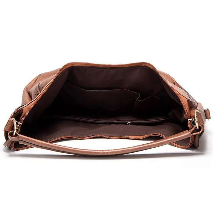 Close-up of a women's elegant leather shoulder bag, showcasing its rich texture & quality craftsmanship.