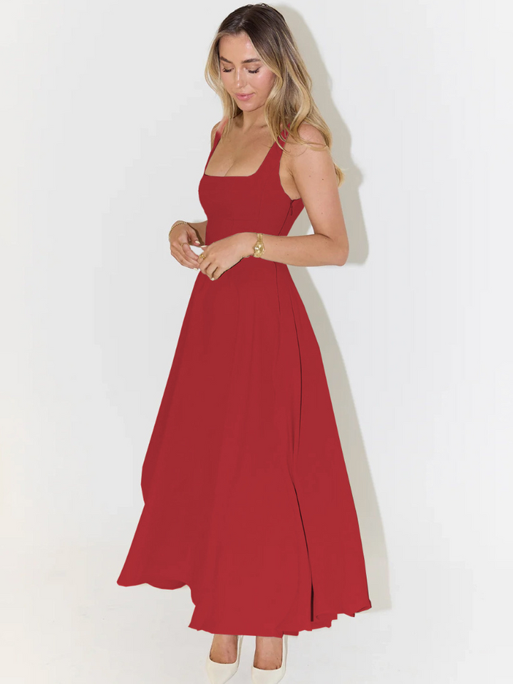 Outdoor shot of chic women's midi dress, perfect for relaxed summer style & comfort.