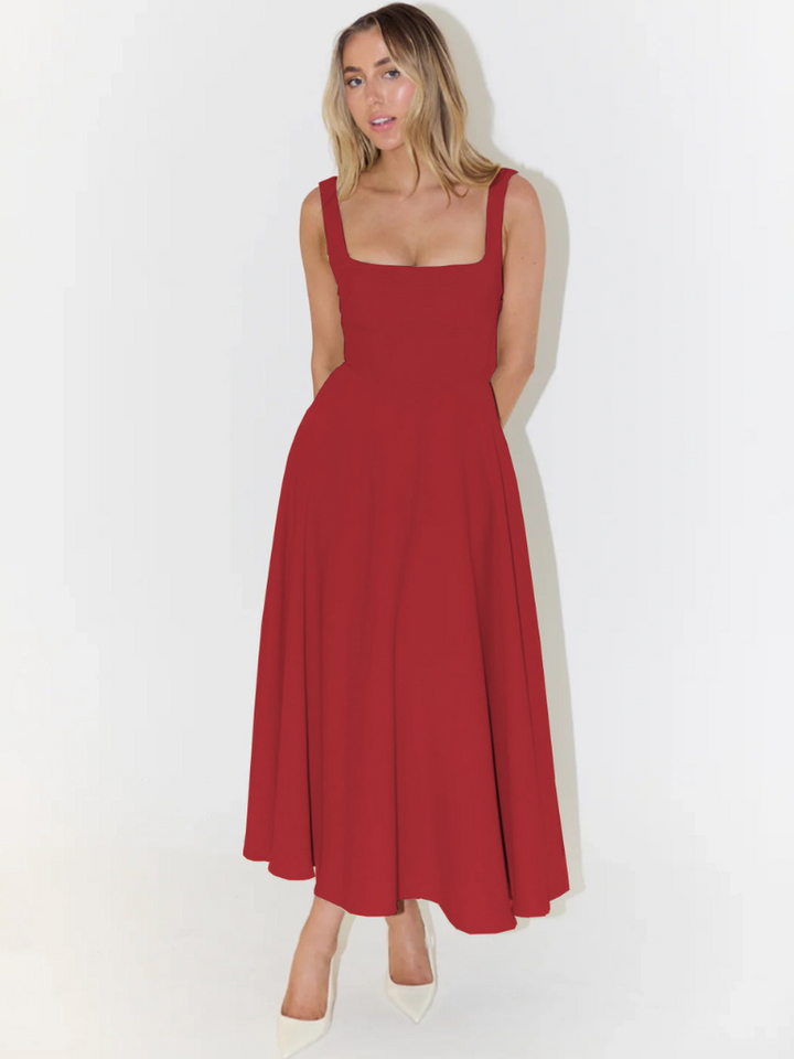 Hemline detail of elegant midi dress, comfortable relaxed fit for women's effortless style.
