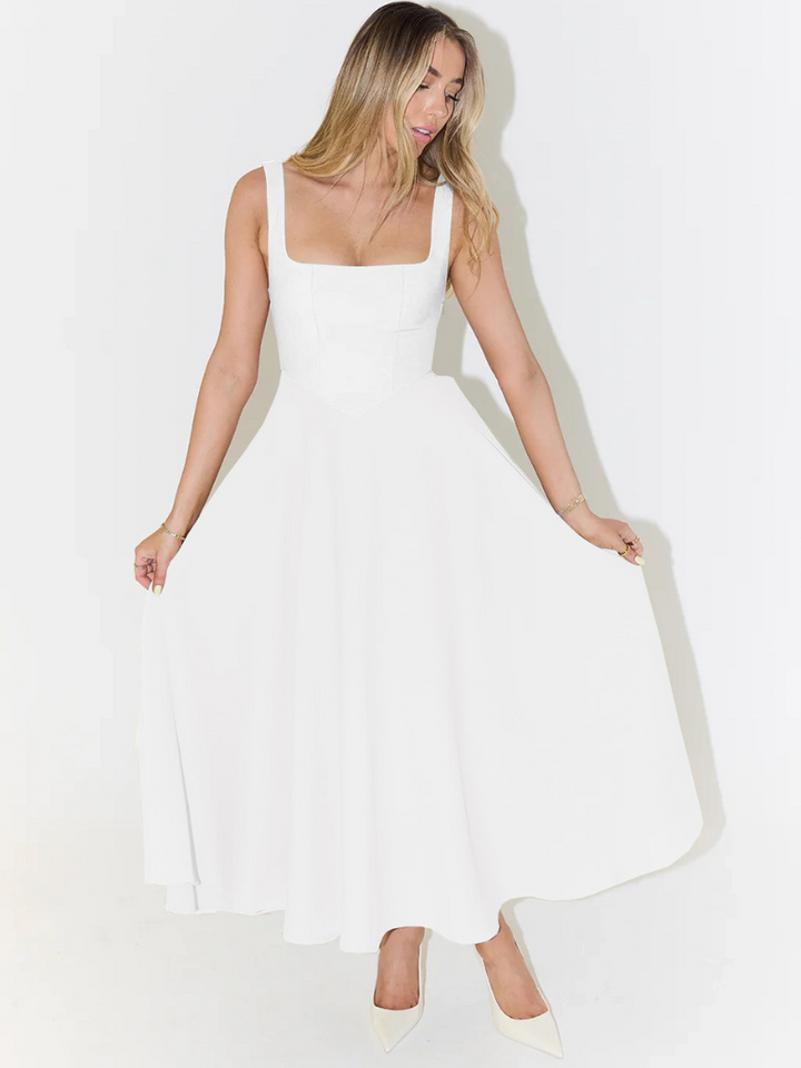 Relaxed fit women's midi dress on model, effortless style for summer comfort.
