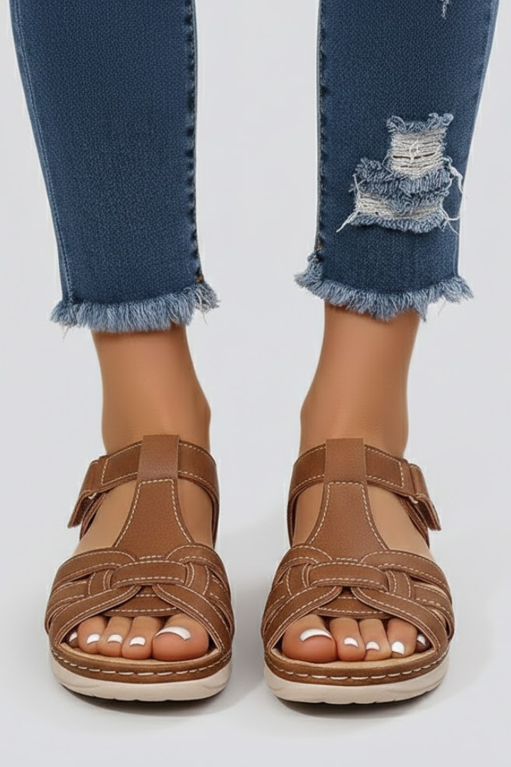 Comfortable women's flat strap sandals for casual summer wear. Ideal everyday open-toe footwear.