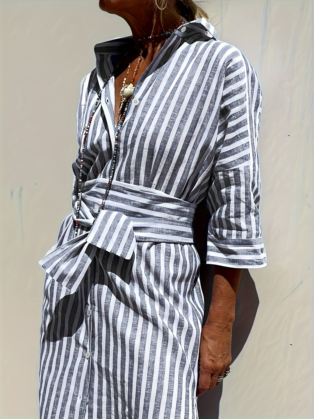 Versatile women's striped belted dress, ideal for everyday wear or a chic casual outing.