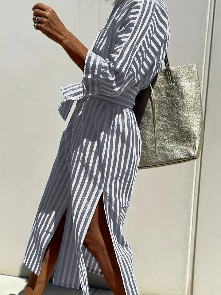 Detail of buttons & belt on a women's striped shirt dress, highlighting quality and style.
