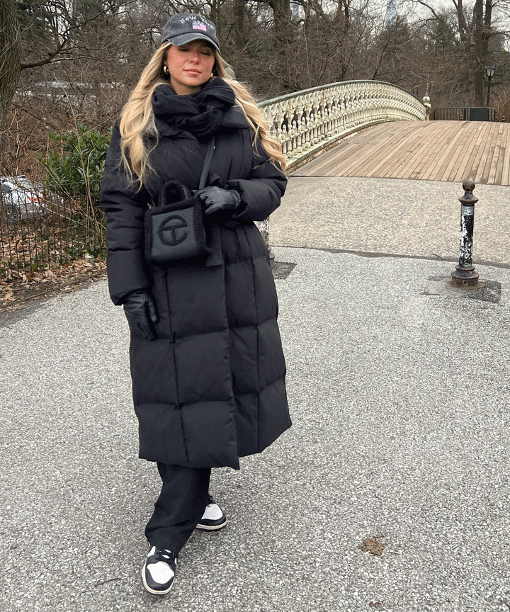 Warm women's long quilted coat, an elegant winter jacket ideal for cold weather outerwear.