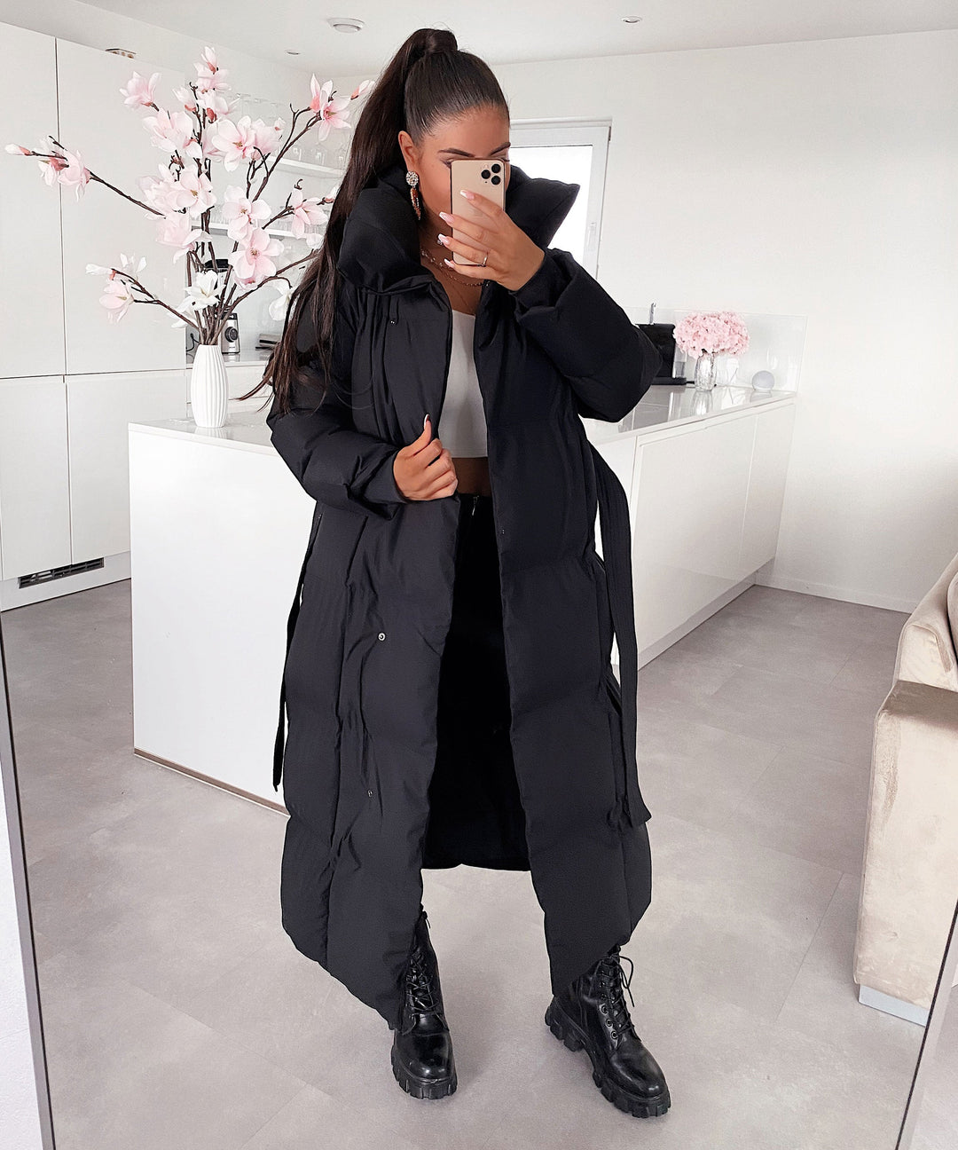 Fashion-forward women's long quilted winter coat, combining warmth with sophisticated style.