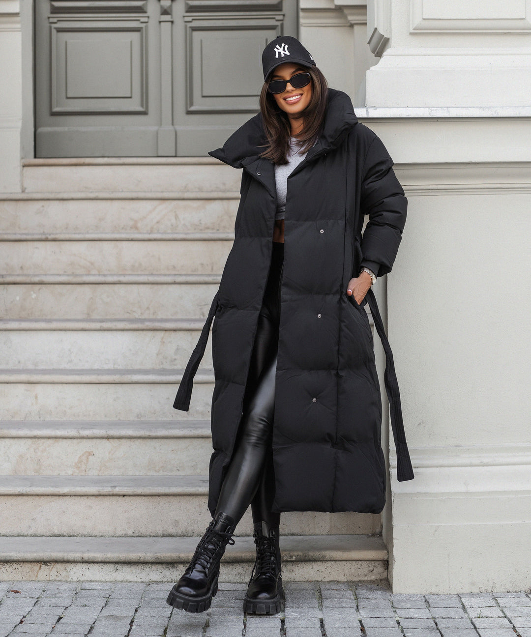 Sophisticated long quilted winter coat for women, ensuring warmth and timeless elegance.