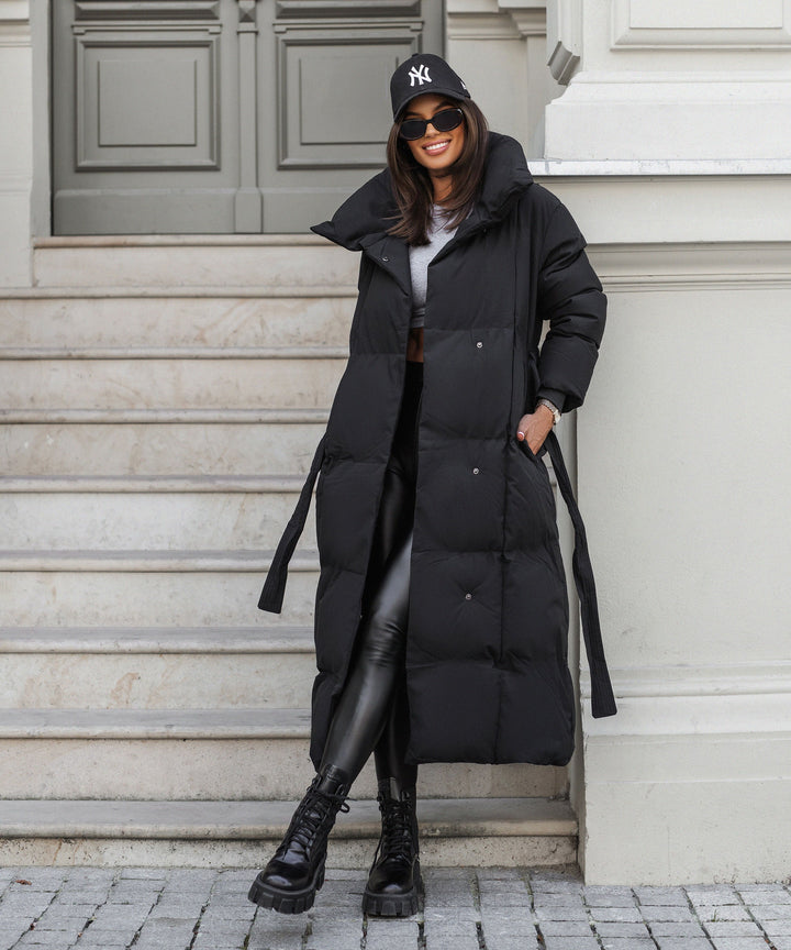 Sophisticated long quilted winter coat for women, ensuring warmth and timeless elegance.
