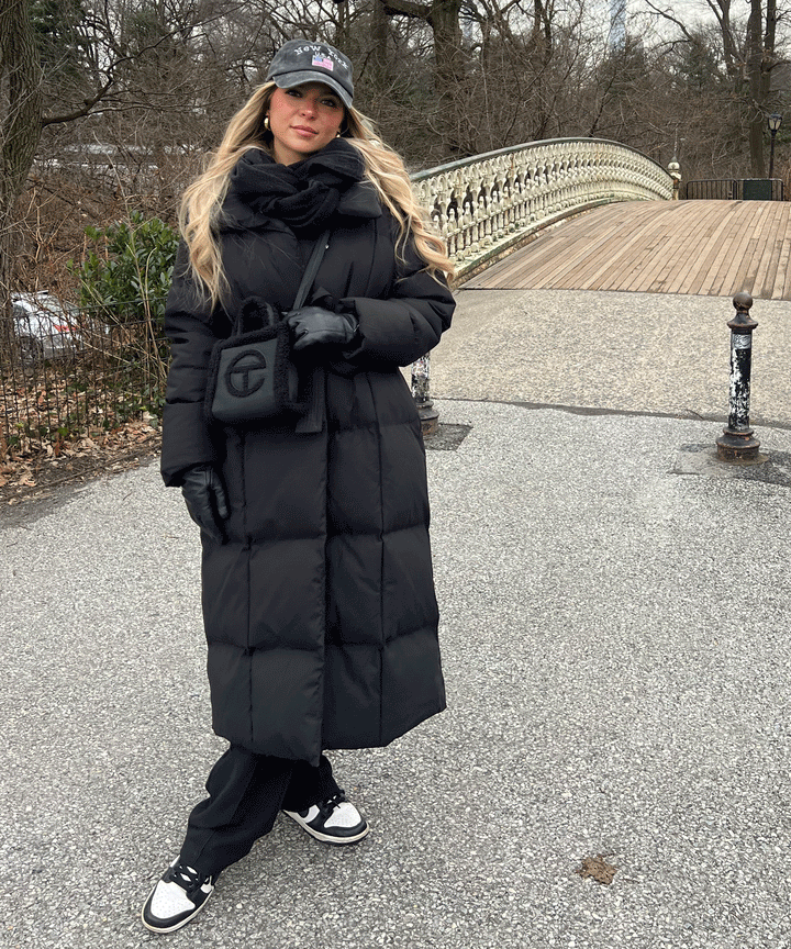 Durable and elegant women's long quilted winter coat, offering superior warmth & sophistication.
