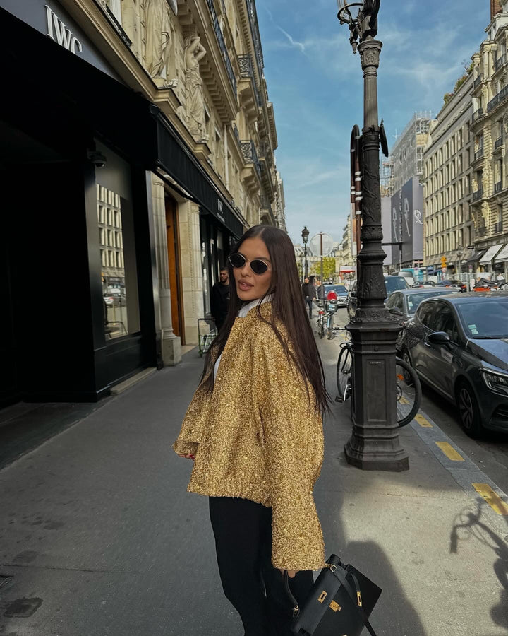 Sophisticated women's tailored metallic jacket, a lightweight mid-season piece for elegant spring and autumn fashion.