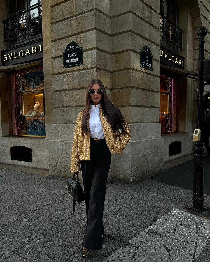 Shimmering metallic women's tailored jacket, elegant mid-season outerwear providing modern style for any occasion.