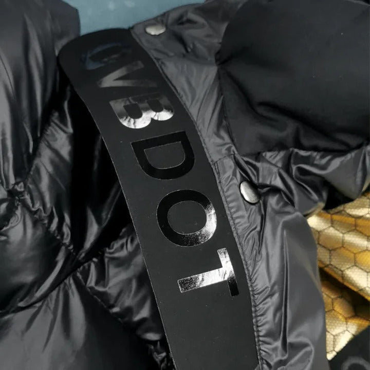 Elegant women's quilted winter jacket, black, with a warm protective hood.