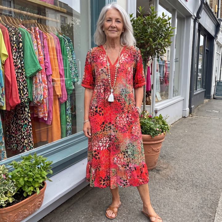 Vibrant A-line midi dress for women, offering flattering coverage & elegant summer style. Perfect for various occasions.