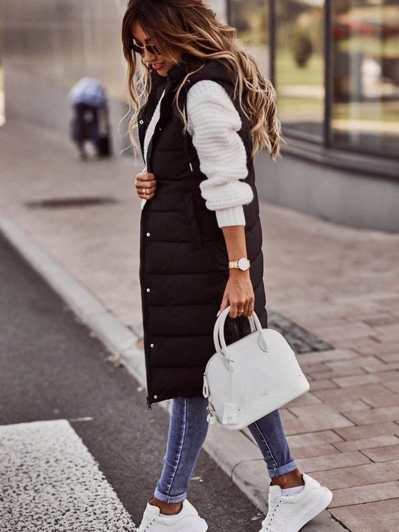 Stylish women's long puffer vest, hooded & quilted. Ideal sleeveless outerwear, perfect layering for casual fall fashion.