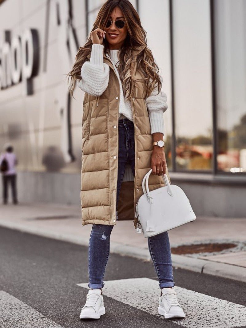 Comfortable women's long hooded puffer vest. Quilted, warm, and practical outerwear, great for women's fall fashion.