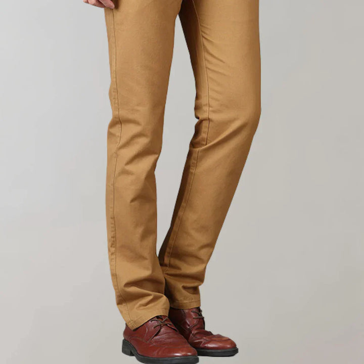 Man in modern slim fit chino pants, showcasing a sharp, comfortable style for smart casual or daily fashion.