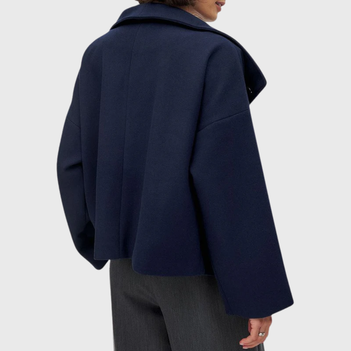 Fashionable women's cropped double-breasted coat, enhancing any sophisticated winter outfit.