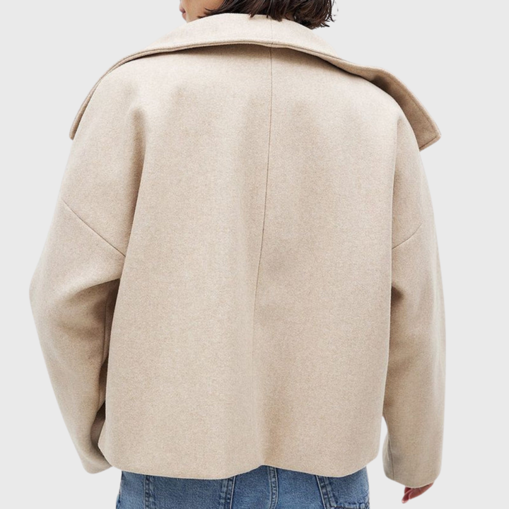 Classic women's cropped double-breasted coat with wide lapels, a timeless elegant jacket.