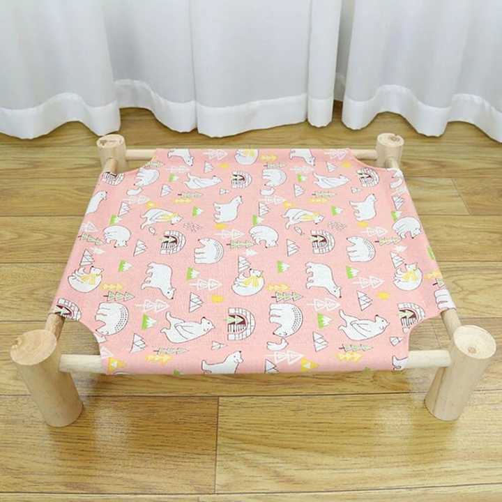 Durable elevated cat bed with a breathable mesh platform & soft, removable washable cover for feline comfort.